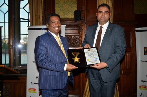 Dr J Sundeep Aanand receiving the Asian UK Achiever's Award 2022 from Rajesh Agrawal, Deputy Mayor, London at the House of Commons (2)